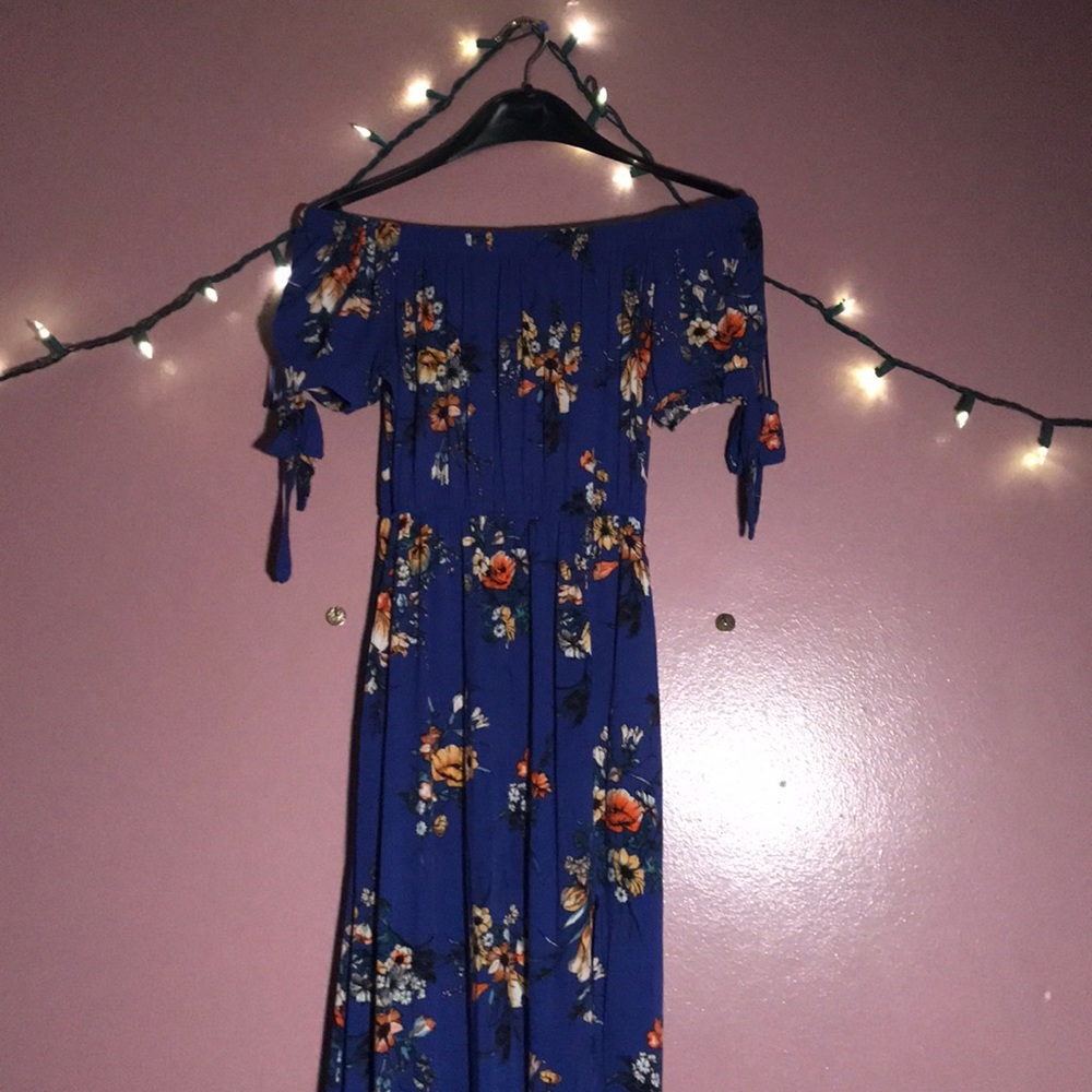 It’s an off the shoulder dress blue with flowers